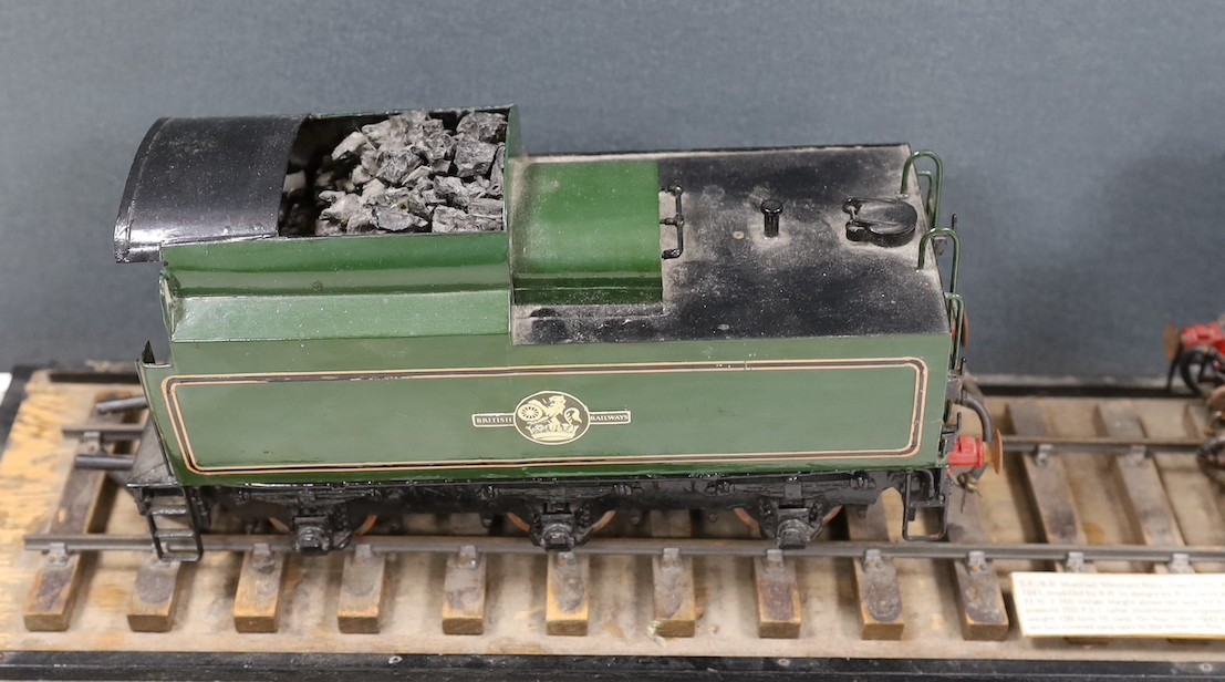 A scratch built scale model ‘S.R./B.R. Modified ‘Merchant Navy’ Class 3 CYL. 4.6.2 Locomotive No.35004 ‘Cunard-White Star’’ and carriage on track. Track length 94.5cm